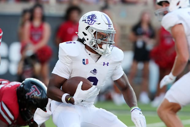 Abilene Christian Wildcats running back Sam Hicks rushes against the Texas Tech Red Raiders.
