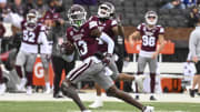Nov 19, 2022; Starkville, Mississippi, USA; Mississippi State Bulldogs cornerback Emmanuel Forbes (13) returns an interception for a touchdown against the East Tennessee State Buccaneers during the second quarter at Davis Wade Stadium at Scott Field. Mandatory Credit: Matt Bush-USA TODAY Sports