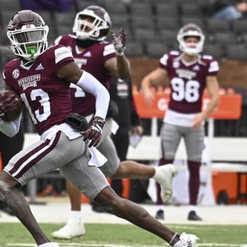 Nov 19, 2022; Starkville, Mississippi, USA; Mississippi State Bulldogs cornerback Emmanuel Forbes (13) returns an interception for a touchdown against the East Tennessee State Buccaneers during the second quarter at Davis Wade Stadium at Scott Field. Mandatory Credit: Matt Bush-USA TODAY Sports