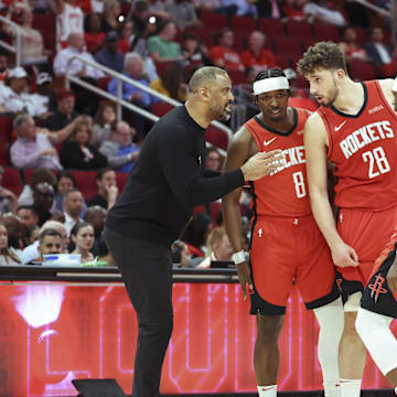Apr 2, 2025; Houston, Texas, USA; Houston Rockets head coach Ime Udoka talks with players during the fourth quarter against the Utah Jazz at Toyota Center. Mandatory Credit: Troy Taormina-Imagn Images