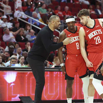 Apr 2, 2025; Houston, Texas, USA; Houston Rockets head coach Ime Udoka talks with players during the fourth quarter against the Utah Jazz at Toyota Center. Mandatory Credit: Troy Taormina-Imagn Images