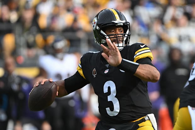 Pittsburgh Steelers QB Russell Wilson throws a pass against the Baltimore Ravens.