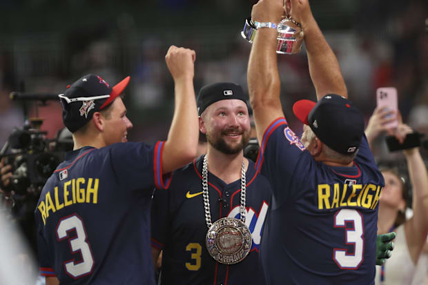Cal Raleigh celebrated with his dad and brother.