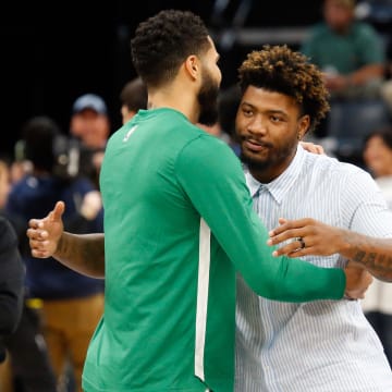 Nov 19, 2023; Memphis, Tennessee, USA; Boston Celtics forward Jayson Tatum (0) and Memphis Grizzlies guard Marcus Smart (36) embrace prior to the game at FedExForum. Mandatory Credit: Petre Thomas-USA TODAY Sports