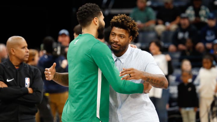 Nov 19, 2023; Memphis, Tennessee, USA; Boston Celtics forward Jayson Tatum (0) and Memphis Grizzlies guard Marcus Smart (36) embrace prior to the game at FedExForum. Mandatory Credit: Petre Thomas-USA TODAY Sports