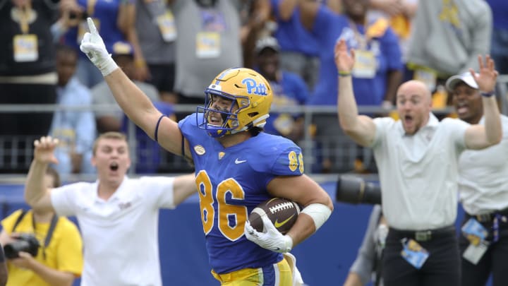 Sep 10, 2022; Pittsburgh, Pennsylvania, USA;  Pittsburgh Panthers tight end Gavin Bartholomew (86) gestures as he runs to score a touchdown against the Tennessee Volunteers during the second quarter at Acrisure Stadium. Mandatory Credit: Charles LeClaire-USA TODAY Sports