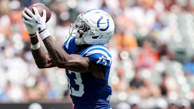 Colts wide receiver Laquon Treadwell (blue and white uniform) catches a big pass downfield.