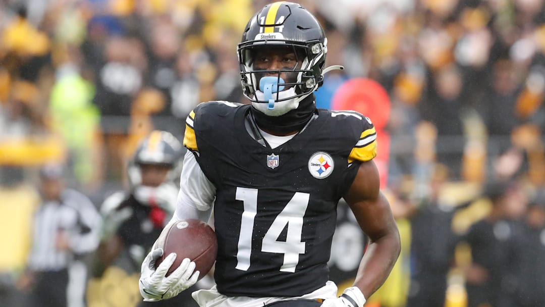 Oct 29, 2023; Pittsburgh, Pennsylvania, USA;  Pittsburgh Steelers wide receiver George Pickens (14) runs to score a touchdown on a pass reception against the Jacksonville Jaguars during the third quarter at Acrisure Stadium. Jacksonville won 20-10. Mandatory Credit: Charles LeClaire-Imagn Images