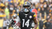 Oct 29, 2023; Pittsburgh, Pennsylvania, USA;  Pittsburgh Steelers wide receiver George Pickens (14) runs to score a touchdown on a pass reception against the Jacksonville Jaguars during the third quarter at Acrisure Stadium. Jacksonville won 20-10. Mandatory Credit: Charles LeClaire-USA TODAY Sports