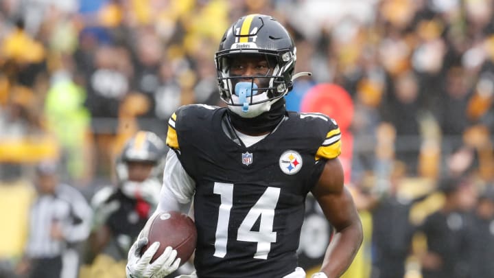 Oct 29, 2023; Pittsburgh, Pennsylvania, USA;  Pittsburgh Steelers wide receiver George Pickens (14) runs to score a touchdown on a pass reception against the Jacksonville Jaguars during the third quarter at Acrisure Stadium. Jacksonville won 20-10. Mandatory Credit: Charles LeClaire-USA TODAY Sports