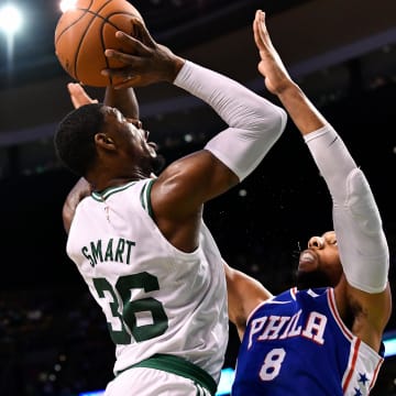 Oct 9, 2017; Boston, MA, USA; Boston Celtics guard Marcus Smart (36) attempts a shot over Philadelphia 76ers center Jahlil Okafor (8) during the first half at the TD Garden. Mandatory Credit: Brian Fluharty-USA TODAY Sports