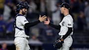 May 20, 2025; Bronx, New York, USA; New York Yankees catcher Austin Wells (28) and relief pitcher Luke Weaver (30) celebrate after defeating the Texas Rangers at Yankee Stadium. Mandatory Credit: Brad Penner-Imagn Images