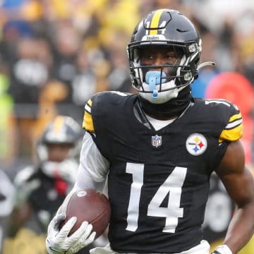 Oct 29, 2023; Pittsburgh, Pennsylvania, USA;  Pittsburgh Steelers wide receiver George Pickens (14) runs to score a touchdown on a pass reception against the Jacksonville Jaguars during the third quarter at Acrisure Stadium. Jacksonville won 20-10. Mandatory Credit: Charles LeClaire-USA TODAY Sports