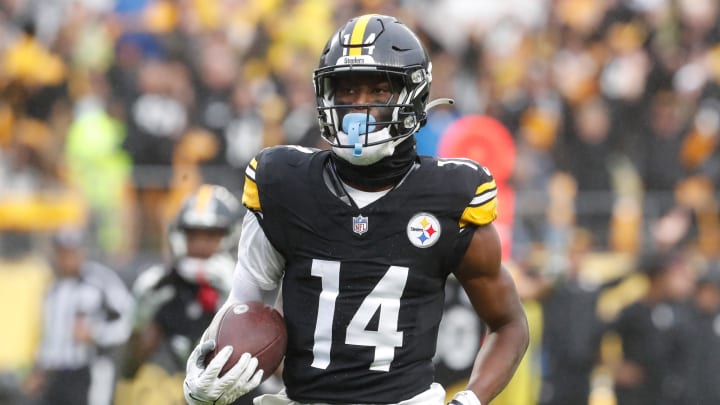 Oct 29, 2023; Pittsburgh, Pennsylvania, USA;  Pittsburgh Steelers wide receiver George Pickens (14) runs to score a touchdown on a pass reception against the Jacksonville Jaguars during the third quarter at Acrisure Stadium. Jacksonville won 20-10. Mandatory Credit: Charles LeClaire-USA TODAY Sports