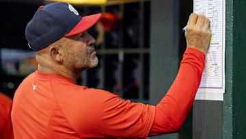 Jun 11, 2024; Detroit, Michigan, USA; Washington Nationals bench coach Miguel Cairo (22) makes changes to his lineup in the eighth inning against the Detroit Tigers at Comerica Park.