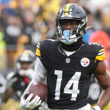 Oct 29, 2023; Pittsburgh, Pennsylvania, USA;  Pittsburgh Steelers wide receiver George Pickens (14) runs to score a touchdown on a pass reception against the Jacksonville Jaguars during the third quarter at Acrisure Stadium. Jacksonville won 20-10. Mandatory Credit: Charles LeClaire-USA TODAY Sports