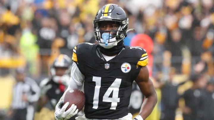 Oct 29, 2023; Pittsburgh, Pennsylvania, USA;  Pittsburgh Steelers wide receiver George Pickens (14) runs to score a touchdown on a pass reception against the Jacksonville Jaguars during the third quarter at Acrisure Stadium. Jacksonville won 20-10. Mandatory Credit: Charles LeClaire-USA TODAY Sports