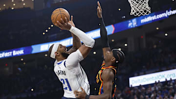 Nov 17, 2024; Oklahoma City, Oklahoma, USA; Dallas Mavericks center Daniel Gafford (21) shoots as Oklahoma City Thunder guard Shai Gilgeous-Alexander (2) defends during the second quarter at Paycom Center. Mandatory Credit: Alonzo Adams-Imagn Images