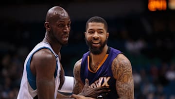 Minnesota Timberwolves forward Kevin Garnett (21) guards Phoenix Suns forward Markieff Morris (11) in the first quarter at Target Center. Mandatory Credit: Brad Rempel-Imagn Images