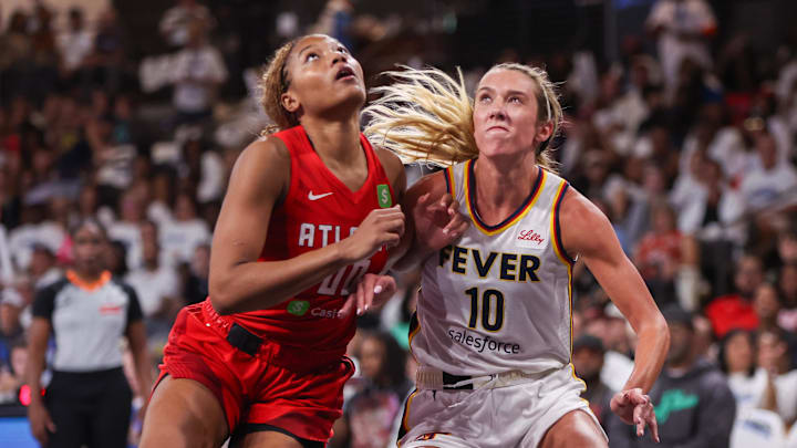 Sep 14, 2025; College Park, Georgia, USA; Atlanta Dream forward Naz Hillmon (00) boxes out Indiana Fever guard Lexie Hull (10) in the second quarter during game one of round one for the 2025 WNBA Playoffs at Gateway Center Arena at College Park. Mandatory Credit: Brett Davis-Imagn Images

