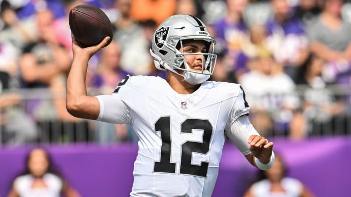 Aug 10, 2024; Minneapolis, Minnesota, USA; Las Vegas Raiders quarterback Aidan O'Connell (12) throws a pass against the Minnesota Vikings during the first quarter at U.S. Bank Stadium. Mandatory Credit: Jeffrey Becker-USA TODAY Sports