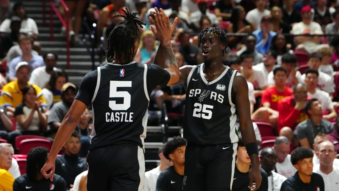 Jul 13, 2024; Las Vegas, NV, USA; San Antonio Spurs guard Sidy Cissoko (25) celebrates with San Antonio Spurs guard Stephon Castle (5) after scoring against the Portland Trail Blazers during the second quarter at Thomas & Mack Center.