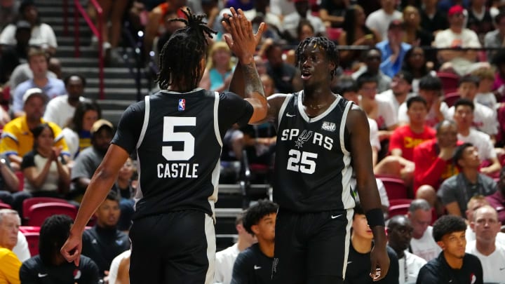 Jul 13, 2024; Las Vegas, NV, USA; San Antonio Spurs guard Sidy Cissoko (25) celebrates with San Antonio Spurs guard Stephon Castle (5) after scoring against the Portland Trail Blazers during the second quarter at Thomas & Mack Center. 