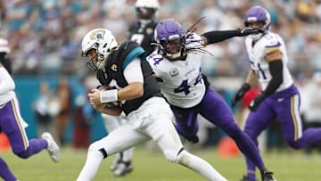 Nov 10, 2024; Jacksonville, Florida, USA; Jacksonville Jaguars quarterback Mac Jones (10) avoids a tackle from safety Joshua Metellus (44) during the during the second quarter at EverBank Stadium. 