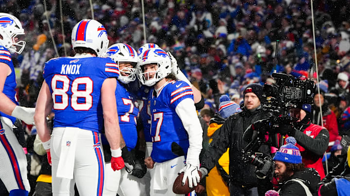 Jan 19, 2025; Orchard Park, New York, USA; Buffalo Bills quarterback Josh Allen (17) celebrates with tight end Dawson Knox (88) after scoring a touchdown during the second quarter against the Baltimore Ravens in a 2025 AFC divisional round game