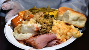 A plate of Thanksgiving dinner being served