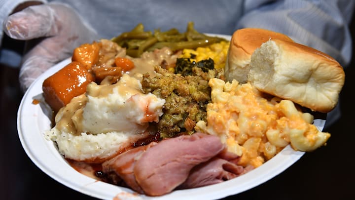 A plate of Thanksgiving dinner being served