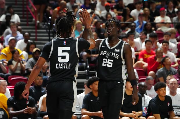 San Antonio Spurs guard Sidy Cissoko (25) celebrates with San Antonio Spurs guard Stephon Castle (5) after scoring. 