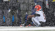 Cincinnati Bengals wide receiver Tee Higgins (5) waits for trainers after hitting his head on the ground on a catch in the second quarter of the NFL Week 14 game between the Buffalo Bills and the Cincinnati Bengals at Highmark Stadium in Orchard Park, N.Y., on Sunday, Dec. 7, 2025.