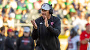 Oct 11, 2025; South Bend, Indiana, USA; NC State Wolfpack head coach Dave Doeren claps as he walks onto the field against the Notre Dame Fighting Irish during the second half at Notre Dame Stadium. Mandatory Credit: Michael Caterina-Imagn Images