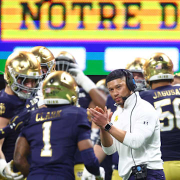 Jan 20, 2025; Atlanta, GA, USA; Notre Dame Fighting Irish head coach Marcus Freeman reacts after a play against the Ohio State Buckeyes during the second half of the CFP National Championship college football game at Mercedes-Benz Stadium. Mandatory Credit: Mark J. Rebilas-Imagn Images