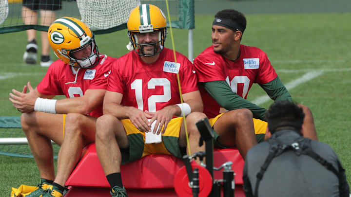 Green Bay Packers quarterback Aaron Rodgers (12) is shown back ups quarterback Tim Boyle,left, and Jordan Love , right, Monday, August 24, 2020 during the team's training camp in Green Bay, Wis.