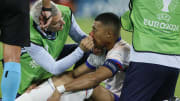 Mbappe receives treatment from France's physio