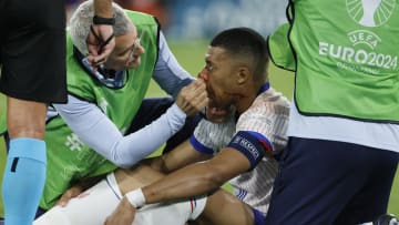 Mbappe receives treatment from France's physio