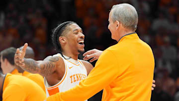 Tennessee's Zakai Zeigler (5) hugs Tennessee head coach Rick Barnes during Senior Day presentations after a men’s college basketball game between Tennessee and South Carolina at Thompson-Boling Arena at Food City Center, Saturday, March 8, 2025.