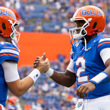 Sep 14, 2024; Gainesville, Florida, USA; Florida Gators quarterback Graham Mertz (15) and Florida Gators quarterback DJ Lagway (2) embrace before a game against the Texas A&M Aggies at Ben Hill Griffin Stadium. Mandatory Credit: Matt Pendleton-Imagn Images