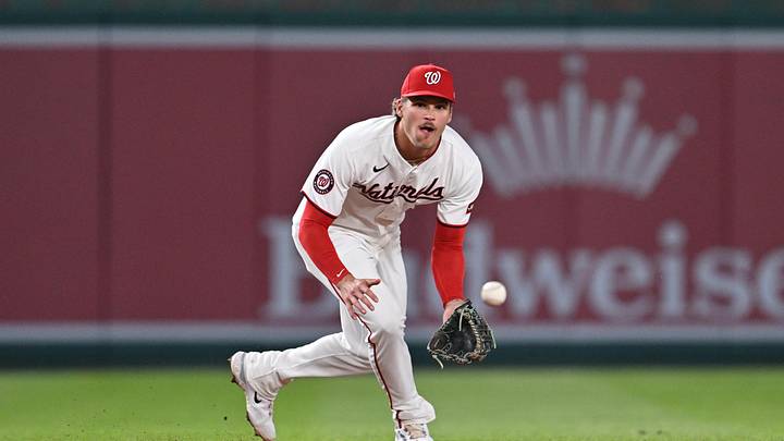 Apr 22, 2026; Washington, District of Columbia, USA;  Washington Nationals infielder Brady House (12) fields a ground ball against the Atlanta Braves at Nationals Park. Mandatory Credit: Jamie Sabau-Imagn Images
