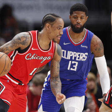 Mar 31, 2022; Chicago, Illinois, USA; Chicago Bulls forward DeMar DeRozan (11) drives to the basket against LA Clippers guard Paul George (13) during the first half at United Center. Mandatory Credit: Kamil Krzaczynski-USA TODAY Sports