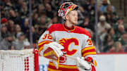 Jan 25, 2025; Saint Paul, Minnesota, USA; Calgary Flames goaltender Dustin Wolf (32) looks on during a break in the action against the Minnesota Wild in the second period at Xcel Energy Center. Mandatory Credit: Matt Blewett-Imagn Images