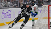 Nov 29, 2025; Los Angeles, California, USA; Los Angeles Kings defenseman Brian Dumoulin (2) is chased down by Vancouver Canucks right wing Brock Boeser (6) during the third period at Crypto.com Arena. Mandatory Credit: Jayne Kamin-Oncea-Imagn Images
