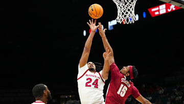 Nov 27, 2024; Las Vegas, Nevada, USA; Rutgers Scarlet Knights center Lathan Sommerville (24) shoots against Alabama Crimson Tide forward Jarin Stevenson (15) during the first half at MGM Grand Garden Arena. Mandatory Credit: Stephen R. Sylvanie-Imagn Images