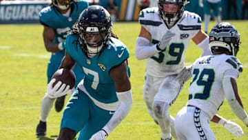 Jacksonville Jaguars wide receiver Brian Thomas Jr. (7) catches a pass and runs in for a touchdown but was called back during the third quarter in an NFL football game at EverBank Stadium, Sunday.]