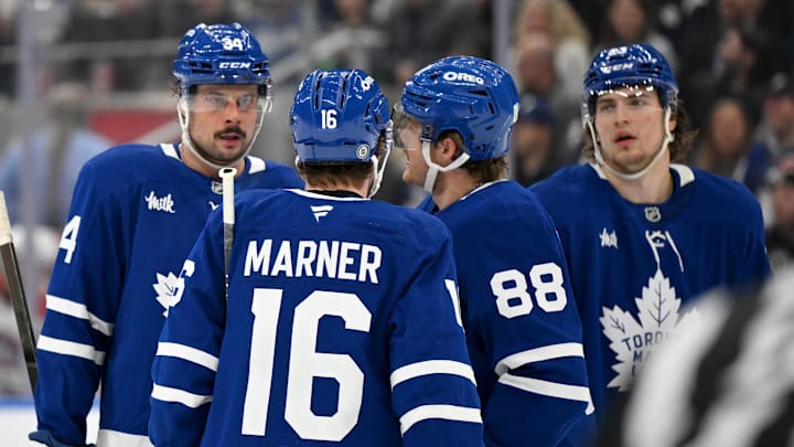 Apr 12, 2025; Toronto, Ontario, CAN;  Toronto Maple Leafs forward Auston Matthews (34) speaks with forwards Mitch Marner (16) and William Nylander (88) and Matthew Knies (23) as they prepare for a powerplay against the Montreal Canadiens in the third period at Scotiabank Arena. Mandatory Credit: Dan Hamilton-Imagn Images