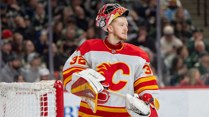 Jan 25, 2025; Saint Paul, Minnesota, USA; Calgary Flames goaltender Dustin Wolf (32) looks on during a break in the action against the Minnesota Wild in the second period at Xcel Energy Center. Mandatory Credit: Matt Blewett-Imagn Images