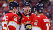 Apr 9, 2024; Sunrise, Florida, USA; Florida Panthers center Eetu Luostarinen (27) talks to center Anton Lundell (15) and center Evan Rodrigues (17) during the first period at Amerant Bank Arena. Mandatory Credit: Sam Navarro-Imagn Images