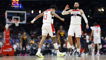 Oct 30, 2024; Washington, District of Columbia, USA; Washington Wizards guard Jordan Poole (13) celebrates with Wizards center Jonas Valanciunas (17) against the Atlanta Hawks in the first half at Capital One Arena. Mandatory Credit: Geoff Burke-Imagn Images